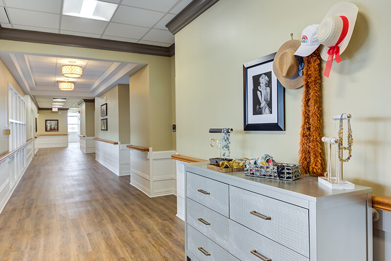Memory care dining area with natural light, granite countertop, and modern lighting at Amazing Grace Senior Living